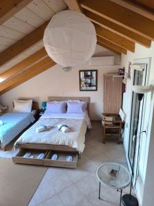 A bed or beds in a room at AB Preveza Apartments -15 Meters Over the Sea