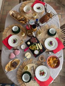 a table with plates of food on top of it at Cocon de Morgon in Villié-Morgon +10 photos