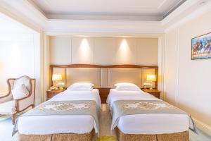 Voodi või voodid majutusasutuse Nanjing Dongjiao State Guesthouse toas