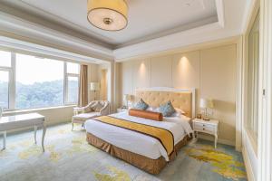 Voodi või voodid majutusasutuse Nanjing Dongjiao State Guesthouse toas