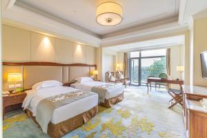 Voodi või voodid majutusasutuse Nanjing Dongjiao State Guesthouse toas