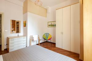 a bedroom with a bed and a dresser at Ciprian in Bologna