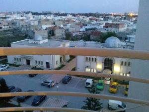 a view of a city with a parking lot at Nice apartment with nice view in El Aouina