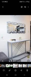 a table in a room with a white wall at Luxore appartments in Nairobi