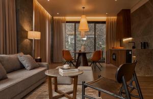 a living room with a couch and a table at Adela Villa Dalat in Khu Chi Lăng