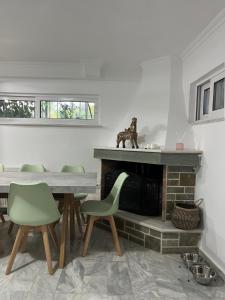 A television and/or entertainment centre at Cosy spot near the beach only 45 min from Athens