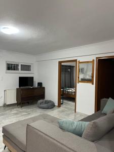 A television and/or entertainment centre at Cosy spot near the beach only 45 min from Athens