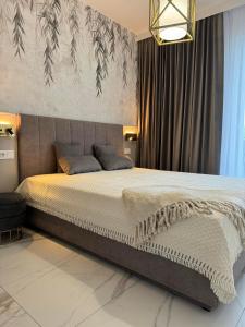 Ένα ή περισσότερα κρεβάτια σε δωμάτιο στο Apartament Morski Sen