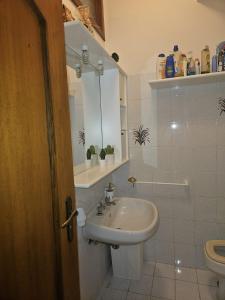 a bathroom with a sink and a toilet at Don Vladi in Letojanni