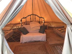 Postel nebo postele na pokoji v ubytování Beaurepaire Bell Tent