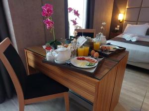 a tray of food on a table in a hotel room at Lacoba Hotel in Athens