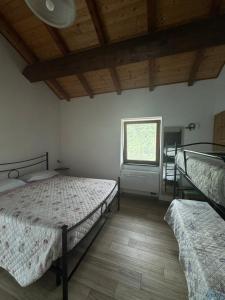 A bed or beds in a room at B&b Al Ciliegio Del Turchino
