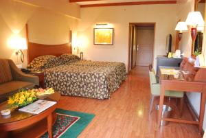 Voodi või voodid majutusasutuse The Carlton Kodaikanal toas