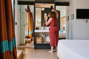 A bed or beds in a room at Toc Hostel Sevilla