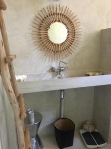 a bathroom with a sink and a mirror on the wall at Une Nuit Au Château in Lyon