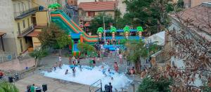 a water park with a water slide in a city at La Grotta Sardegna 4 Bedrooms in Urzulei