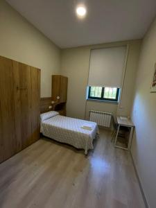 Posteľ alebo postele v izbe v ubytovaní Casa Diocesana VIA LUCIS