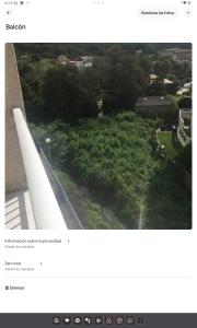 an aerial view of a park with trees and a building at Maison le Vrai in Caldas de Reis