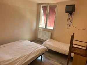 Ένα ή περισσότερα κρεβάτια σε δωμάτιο στο Urbain V