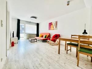 a living room with a table and a couch at Apartment in Bergisch Gladbach in Bergisch Gladbach