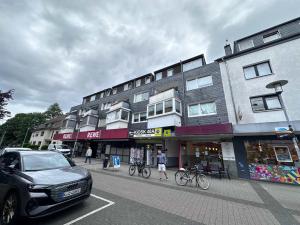 a car parked in a parking lot in front of a building at Apartment in Bergisch Gladbach in Bergisch Gladbach