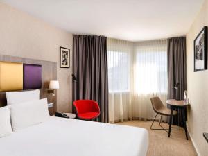 Postel nebo postele na pokoji v ubytování Mercure Budapest Korona