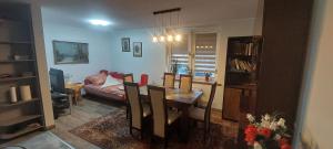 a living room with a table and a dining room at Sunstreet in Lubin