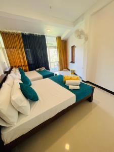 Postel nebo postele na pokoji v ubytování Viyanga Homestay