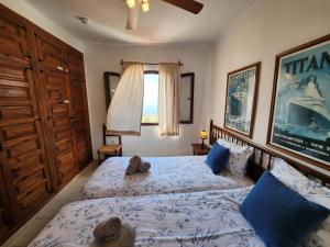 a bedroom with two beds and a window at R1370 Mandarinos 61 in El Molino +18 photos