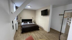 Postel nebo postele na pokoji v ubytování Appart Hotel Gambetta