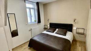 Postel nebo postele na pokoji v ubytování Appart Hotel Gambetta