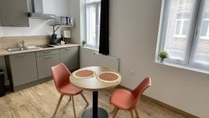 Kuchyň nebo kuchyňský kout v ubytování Appart Hotel Gambetta