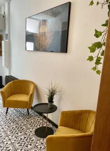 TV a/nebo společenská místnost v ubytování Appart Hotel Gambetta