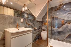 a bathroom with a sink and a shower at Beresford House in Wells next the Sea +20 photos