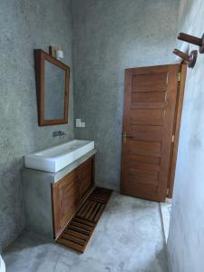 a bathroom with a sink and a mirror at LoSu Polhena in Polhena +38 photos