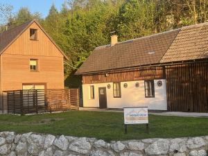a building with a sign in front of a house at Sacherl am Bacherl in Rosenau am Hengstpass +6 photos