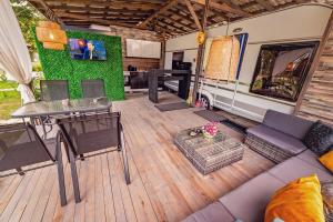 an rv living room with a couch and a table at Каравани AVI IRIS Фичоза in Varna City