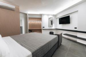 TV a/nebo společenská místnost v ubytování Golden Sun Hotel