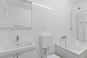 Ένα μπάνιο στο Business-Apartments mit drei Schlafzimmern in Lippstadt +31 φωτογραφίες