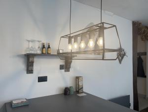 a chandelier hanging over a table in a room at The Old Gallery in Winchcombe