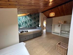 a bedroom with a large bed with a mural on the wall at Escapada in Puigcerdà
