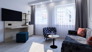 TV a/nebo společenská místnost v ubytování Dom-Hotel