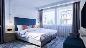 Postel nebo postele na pokoji v ubytování Dom-Hotel