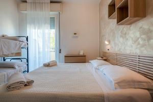 Postel nebo postele na pokoji v ubytování HOTEL JOHN