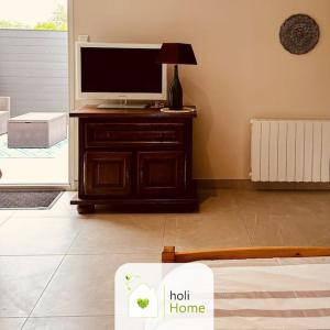 TV a/nebo společenská místnost v ubytování H9 Petite maison de campagne + 21 fotografií