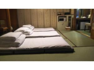 Postel nebo postele na pokoji v ubytování Tomareru sento taka no yu - Vacation STAY 00556v + 25 fotografií