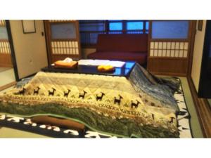 Postel nebo postele na pokoji v ubytování Tomareru sento taka no yu - Vacation STAY 00556v