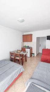 Voodi või voodid majutusasutuse Zlatni Pijesak - Apartmani Čanj toas