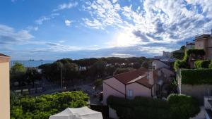 a view of a city with a cloudy sky at Hotel Tritone in Trieste