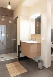 a bathroom with a sink and a shower at Luxury Stay in City Center with terrace in Graz